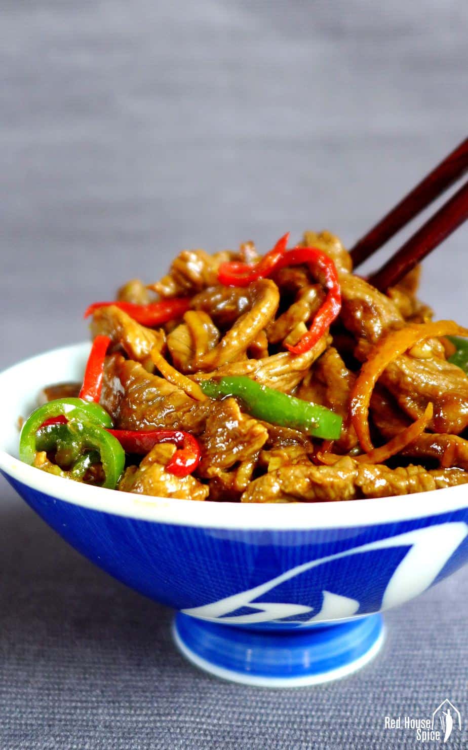 Stir-fried orange beef in a bowl