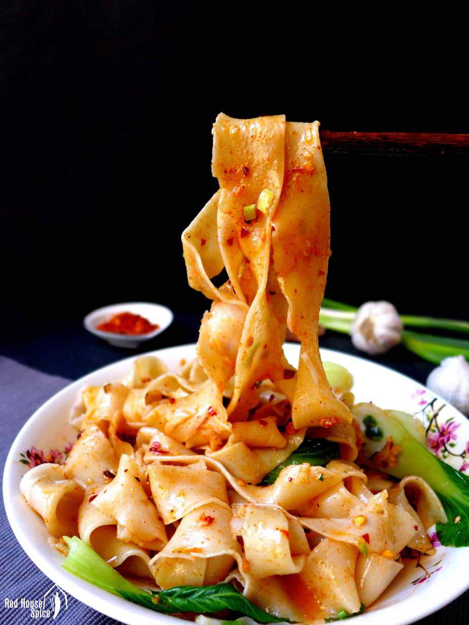 Biang Biang noodles picked up by a pair of chopsticks