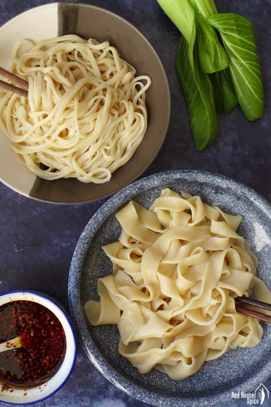 Two bowls of freshly cooked hand-pulled noodles