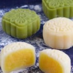 Mooncakes with one cut in halves with overlay text that says snow skin mooncakes.