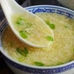 spooning egg drop soup.