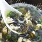 seaweed and egg soup in a spoon.