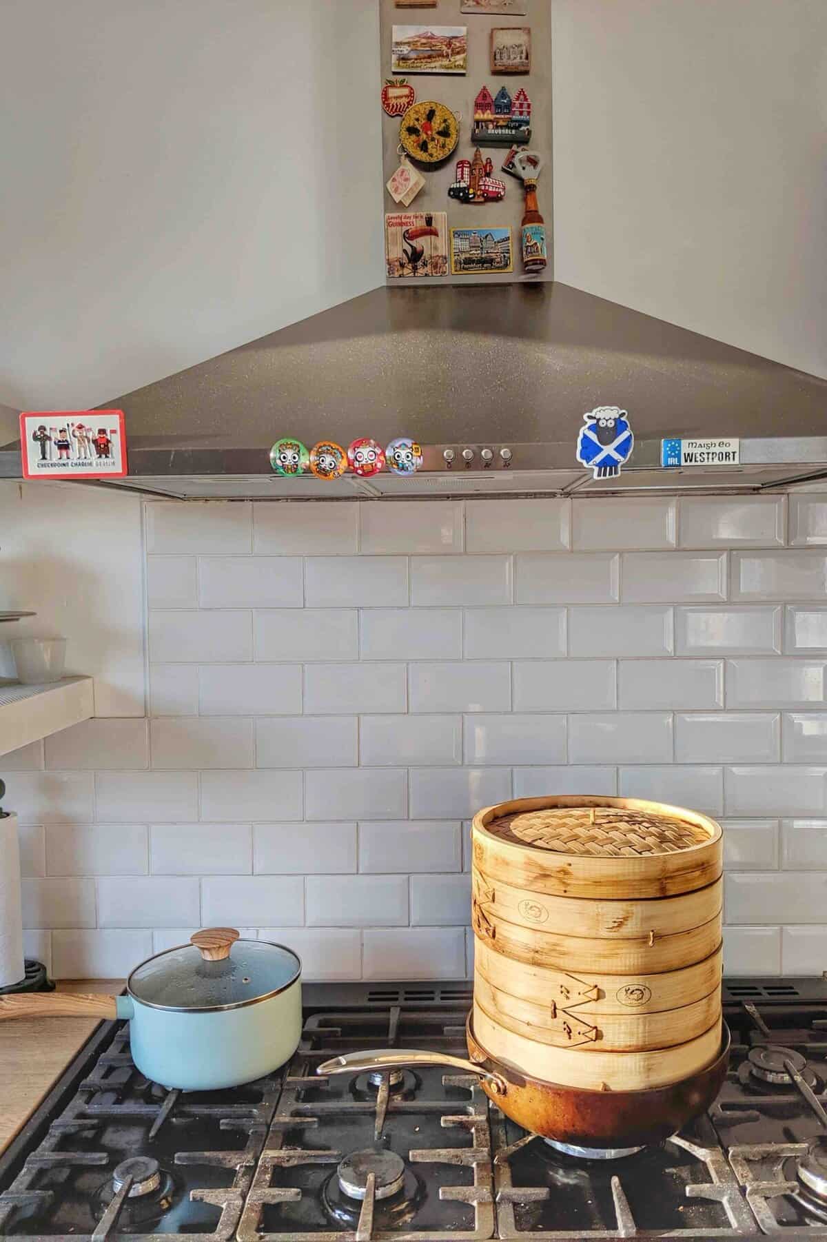a bamboo steamer over a stove.