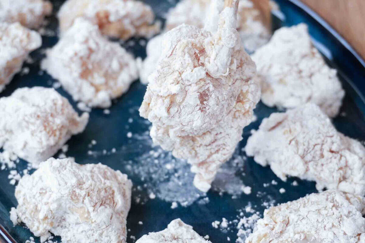 chicken coated with cornstarch and flour.